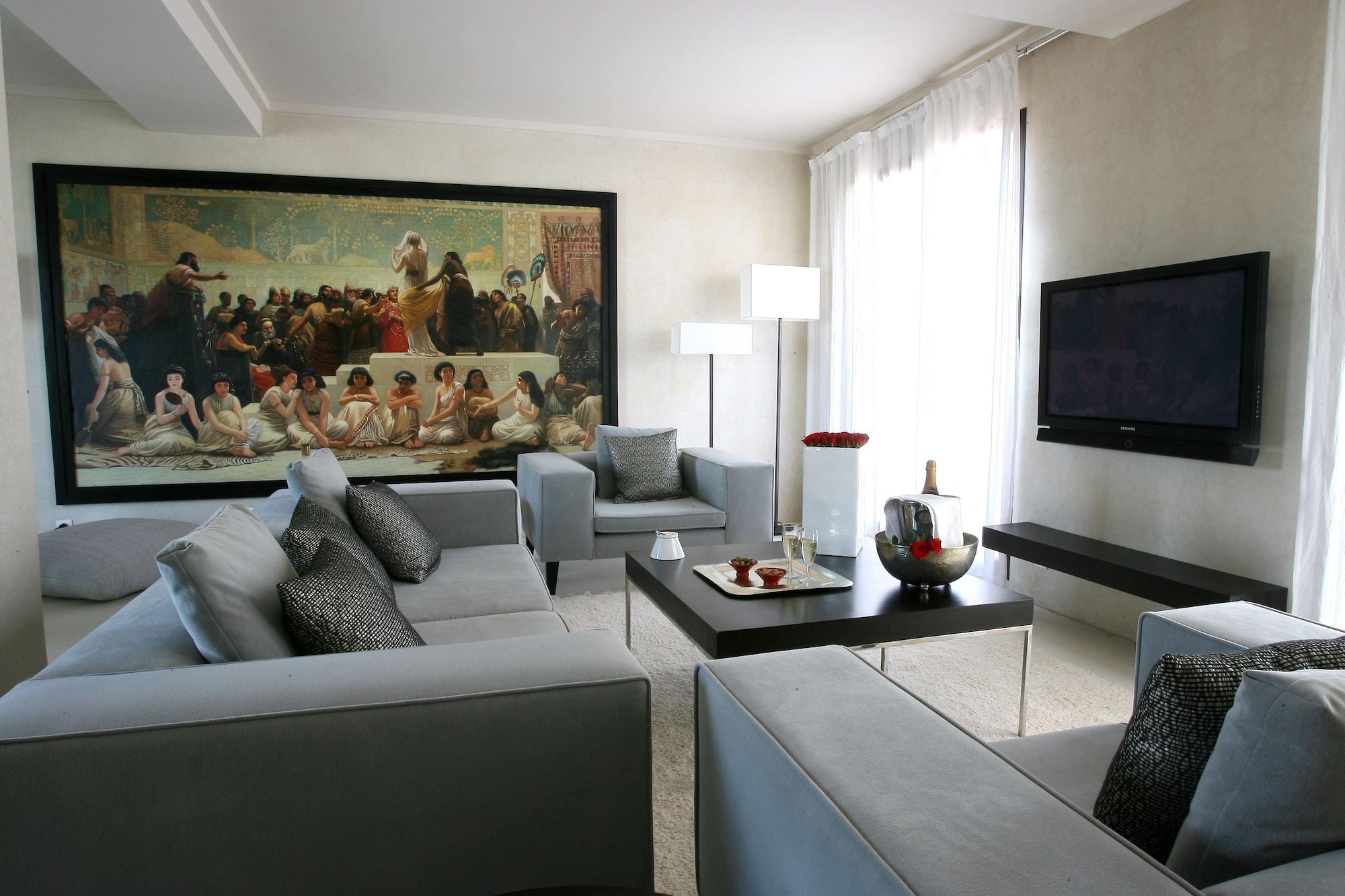 เล ฌาร์แด็ง เดอ ลา กูตูเบีย Hotel มาร์ราเกช ห้อง รูปภาพ A living room